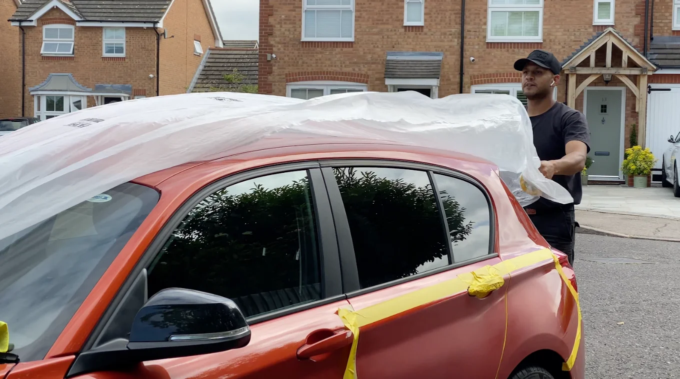 King technician carefully preparing a vehicle for mobile paintwork repair